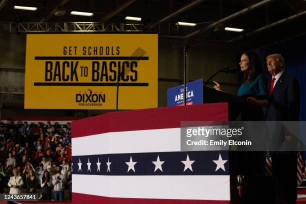 Republican gubernatorial candidate Tudor Dixon joins former President Donald Trump on stage during a Save America rally on October 1, 2022 in Warren,...