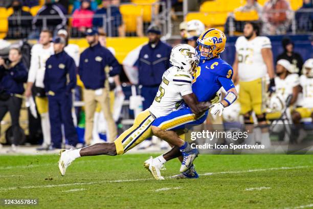 Pittsburgh Panthers quarterback Kedon Slovis is hit after throwing a pass during the college football game between the Georgia Tech Yellow Jackets...