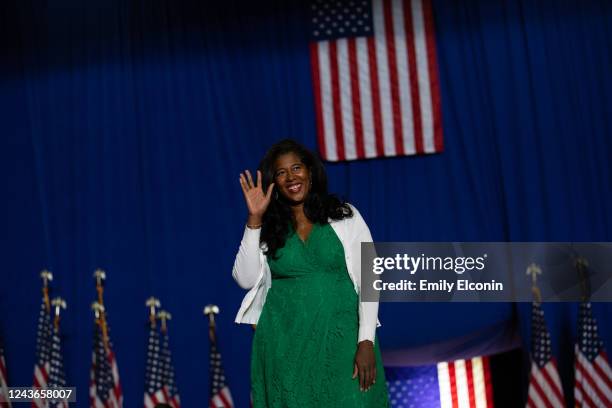 Republican candidate for Secretary of State Kristina Karamo waves to the crowd before she speaks during a Save America rally on October 1, 2022 in...