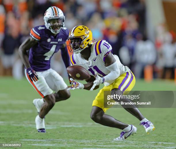 Brian Thomas Jr. #11 of the LSU Tigers attempts to catch a pass in front of D.J. James of the Auburn Tigers during the second half of the game at...