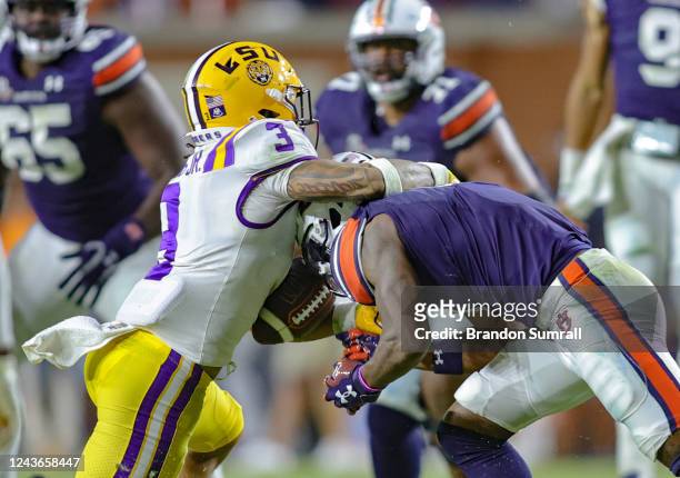 Greg Brooks Jr. #3 of the LSU Tigers strips the ball from an Auburn Tigers receiver late in the second half of the game at Jordan-Hare Stadium on...