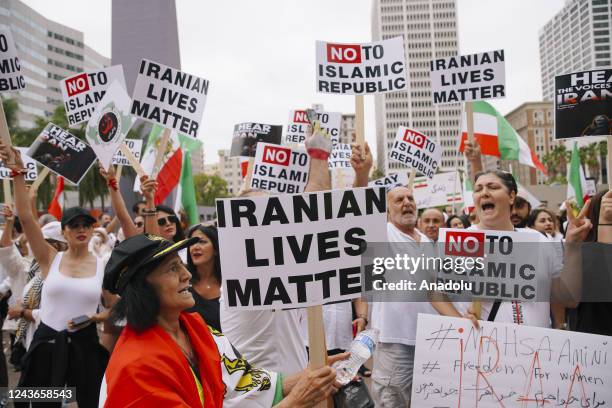 Crowd gathers with signs and flags, as part of a global protest after the death of Mahsa Amini in Iran on October 01, 2022 in Downtown Los Angeles,...