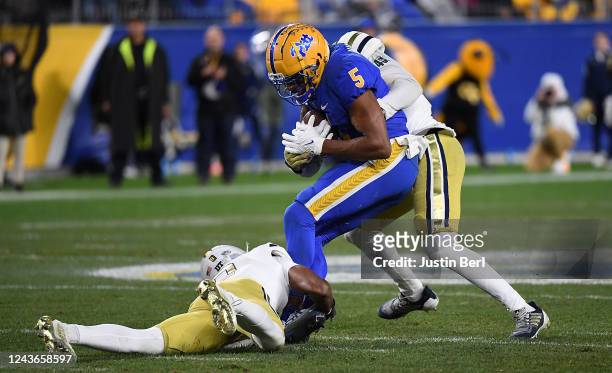 Jared Wayne of the Pittsburgh Panthers is wrapped up for a tackle by Derrik Allen of the Georgia Tech Yellow Jackets in the third quarter during the...