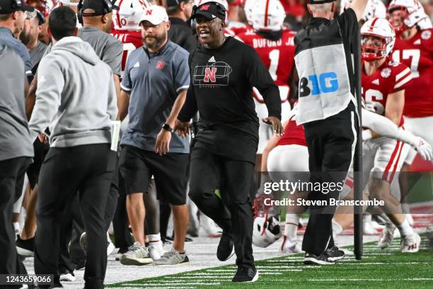 Head coach Mickey Joseph of the Nebraska Cornhuskers celebrates a touchdown in the second quarter of the game against the Indiana Hoosiers at...