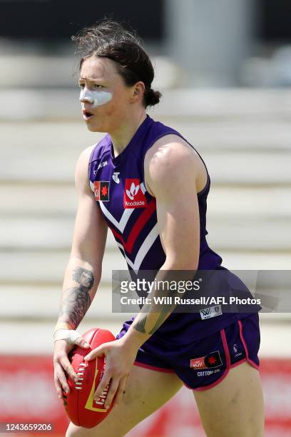 Roxanne Roux of the Dockers looks to pass the ball during the 2022 S7 AFLW Round 06 match between the Fremantle Dockers and the Melbourne Demons at...
