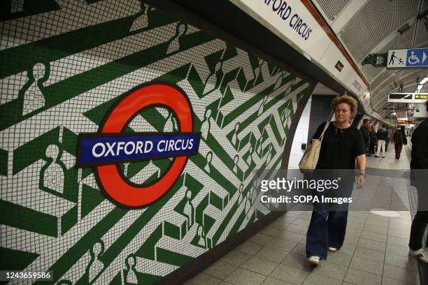 Passenger in Oxford Circus London Underground station.