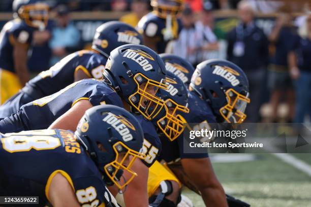 The Toledo offensive line waits for the ball to be snapped during the second quarter of a Mid-American Conference regular season college football...