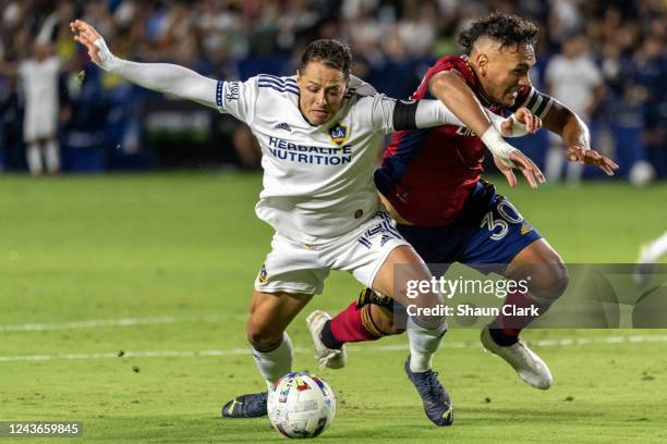 Javier Hernández of Los Angeles Galaxy battles Marcelo Silva of Real Salt Lake and earns a penalty kick during the match against Real Salt Lake at...