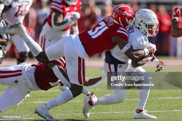 Louisiana-Lafayette Ragin Cajuns safety Tyree Skipper tackles South Alabama Jaguars wide receiver Caullin Lacy during a college football game between...