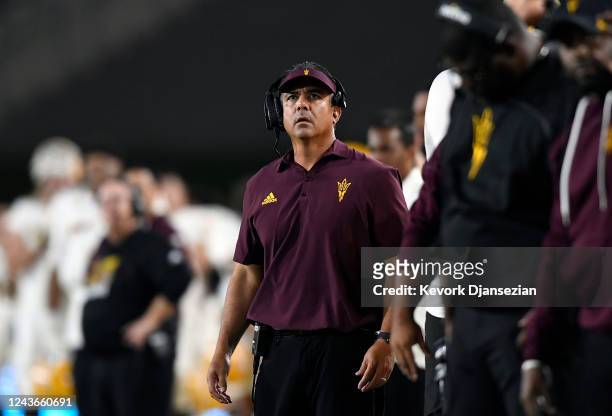 Head coach Shaun Aguano of the Arizona State Sun Devils looks at the score board during the second half against USC Trojans at United Airlines Field...