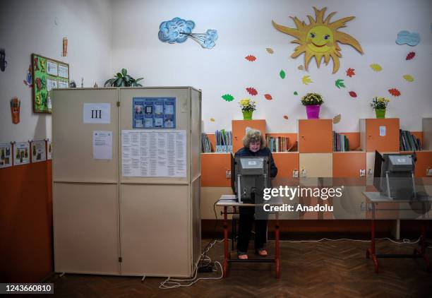 An elderly woman casts her vote during an early parliamentary elections at a polling station in Sofia, Bulgaria on October 02, 2022. Bulgaria holds...