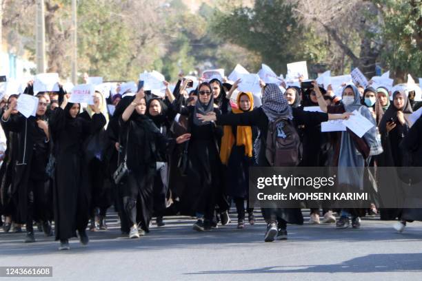 Afghan female students chant "Education is our right, genocide is a crime" during a protest as they march from the University of Herat toward to the...