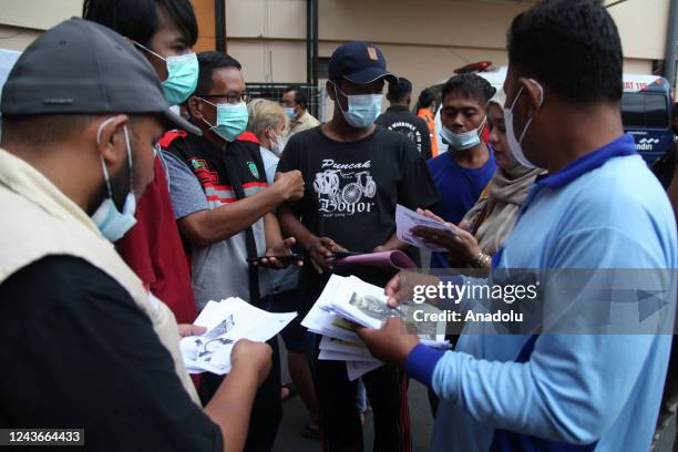 Families of victims seek information about their family members who were victims of a riot at a football match at a public hospital, in Malang, East...