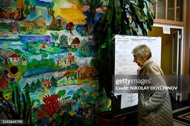 Voter arrives to vote at a polling station during the country's parliamentary elections in Sofia on October 2, 2022. - Bulgarians began voting in...