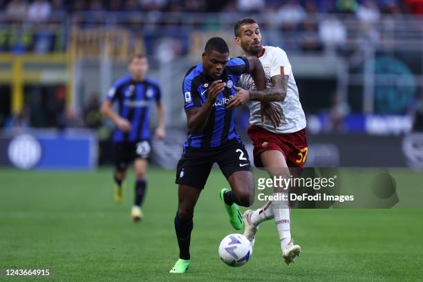 Denzel Dumfries of FC Internazionale and Leonardo Spinazzola of AS Roma battle for the ball during the Serie A match between FC Internazionale and AS...