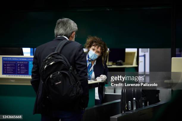 Man checks in at Milan Malpensa airport on the first day of reopening after the lockdown on June 03, 2020 in Milan, Italy. Flights have started again...