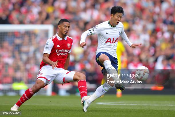 Son Heung-min of Tottenham Hotspur in action with William Saliba of Arsenal during the Premier League match between Arsenal FC and Tottenham Hotspur...