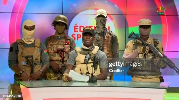 This video grab taken from a video broadcasted on October 2, 2022 by the national television of Burkina Faso shows sub-lieutenant Jean-Baptiste Kabre...