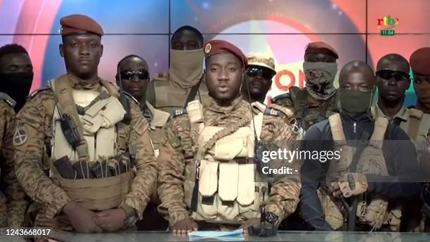 This video grab taken from a video broadcasted on October 2, 2022 by the national television of Burkina Faso shows Captain Kiswendsida Farouk Azaria...