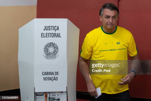 Brazilian president and re-election candidate Jair Bolsonaro votes during the legislative and general elections October 2, 2022 in Rio de Janeiro,...