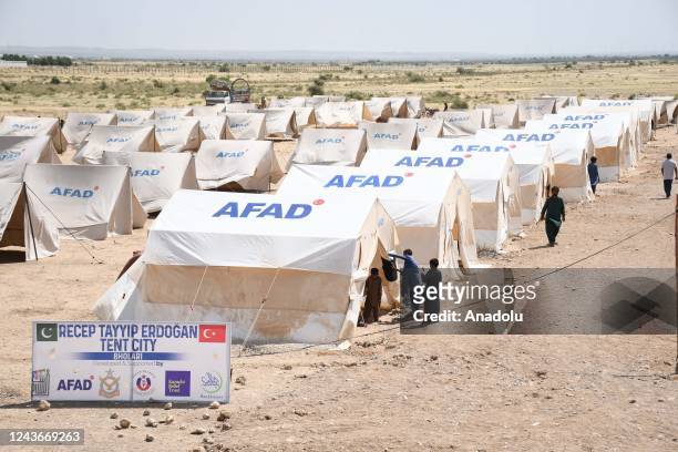 Pakistani flood victims rests in a tent at a temporary housing facility set up by Turkish Disaster and Emergency Management Authority for affectees...