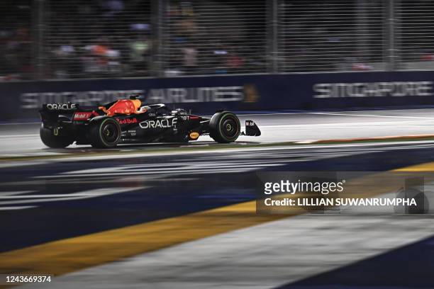 Red Bull Racing's Dutch driver Max Verstappen drives during the Formula One Singapore Grand Prix night race at the Marina Bay Street Circuit in...
