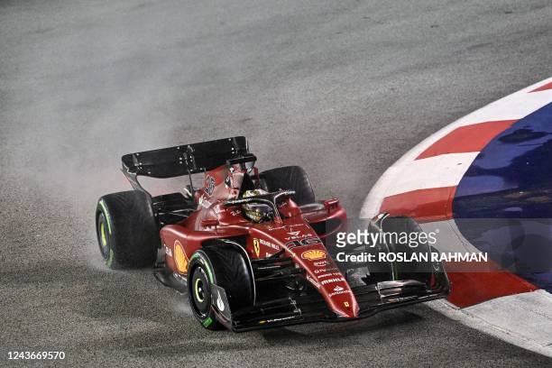 Ferrari's Monegasque driver Charles Leclerc drives during the Formula One Singapore Grand Prix night race at the Marina Bay Street Circuit in...