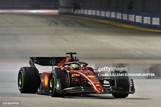 Ferrari's Monegasque driver Charles Leclerc drives during the Formula One Singapore Grand Prix night race at the Marina Bay Street Circuit in...