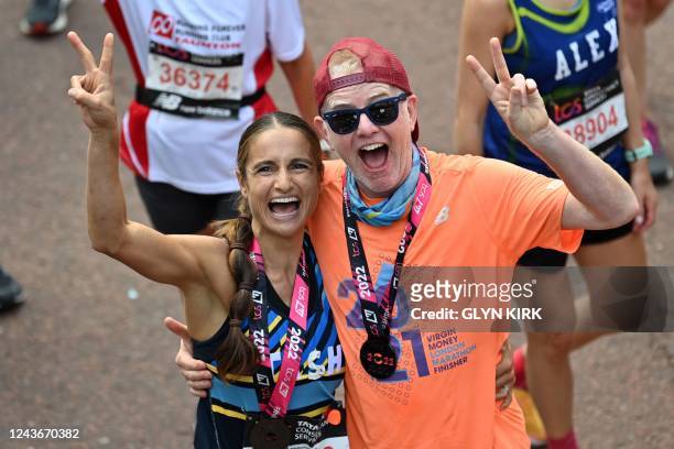 Virgin radio DJ Chris Evans celebrates at the finish of the 2022 London Marathon in central London on October 2, 2022. - - Restricted to editorial...