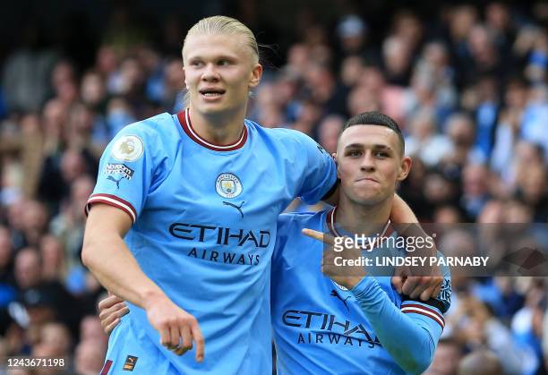 Manchester City's English midfielder Phil Foden celebrates scoring his team's sixth goal and his third with Manchester City's Norwegian striker...