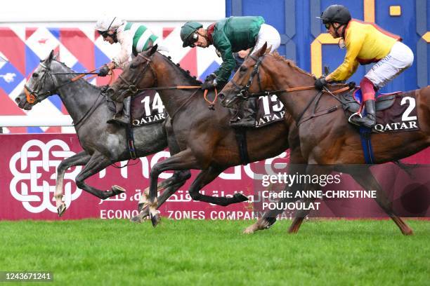 British jockey Luke Morris riding on "Alpinista" crosses the finish line to win The Prix de l'Arc de Triomphe horse race ahead of Belgian jockey...