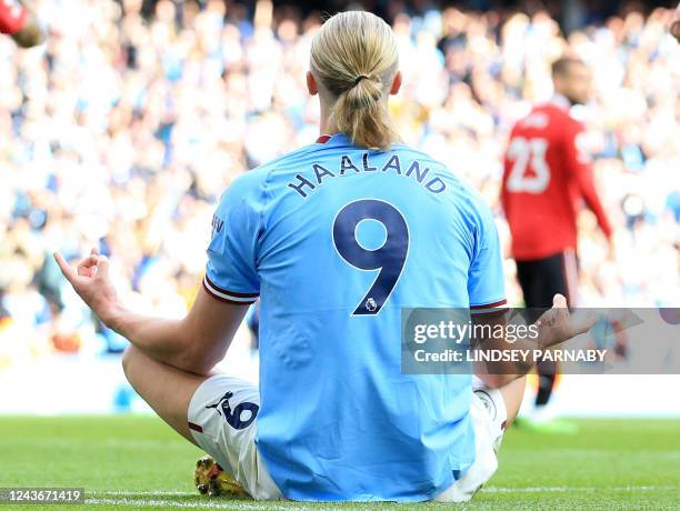 Manchester City's Norwegian striker Erling Haaland celebrates scoring his team's fifth goal and his third during the English Premier League football...