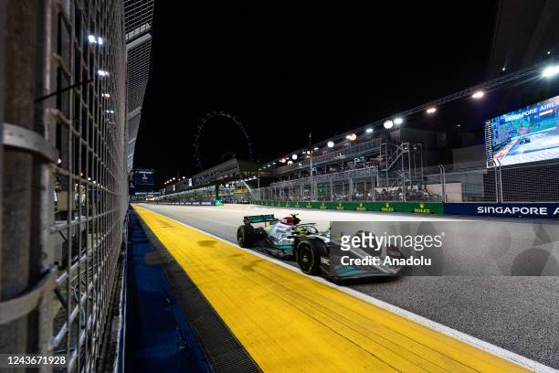 Mercedes' British driver Lewis Hamilton drives during the Formula One Singapore Grand Prix night race at the Marina Bay Street Circuit in Singapore...