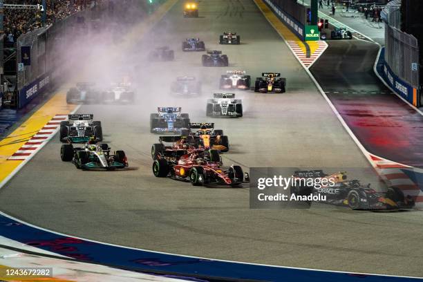 Formula one pilots drives during the Formula One Singapore Grand Prix night race at the Marina Bay Street Circuit in Singapore on October 2, 2022.