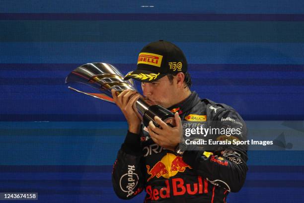 Sergio Perez of Mexico and Oracle Red Bull celebrates on the podium during the F1 Grand Prix of Singapore at Marina Bay Street Circuit on October 2,...