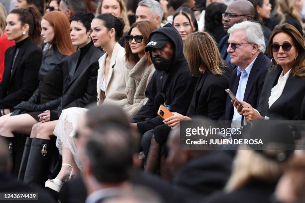 Rapper Kanye West , US actress Madelaine Petsch and US singer Halsey attend the Givenchy Spring-Summer 2023 fashion show during the Paris Womenswear...