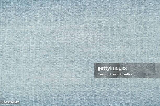 light blue washed jeans denim background texture - light blue stockfoto's en -beelden