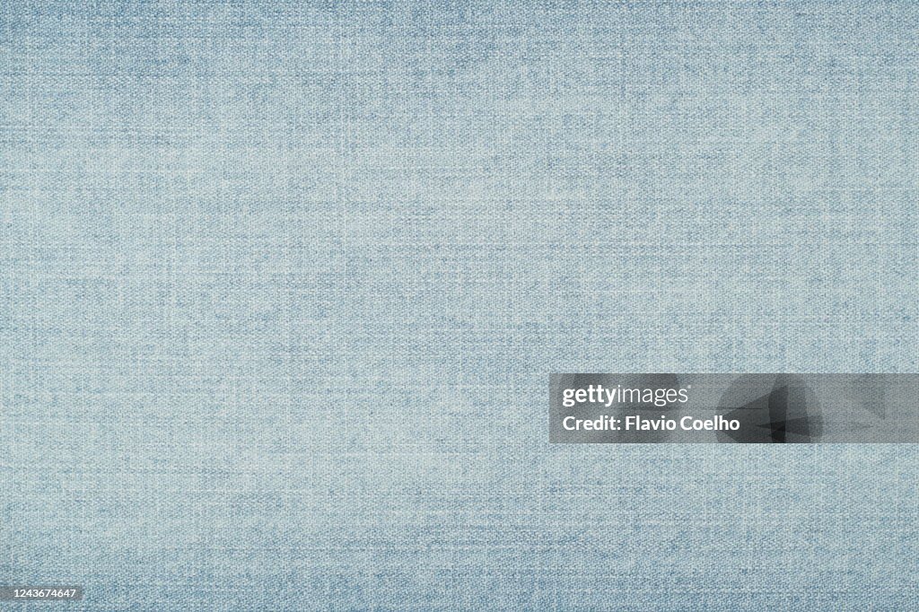 Light blue washed jeans denim background texture