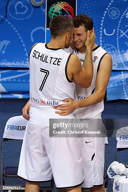 Sven Schultze and Philipp Schwethelm of Germany celebrate the 73-67 victory after the EuroBasket 2011 second round group E match between Germany and...