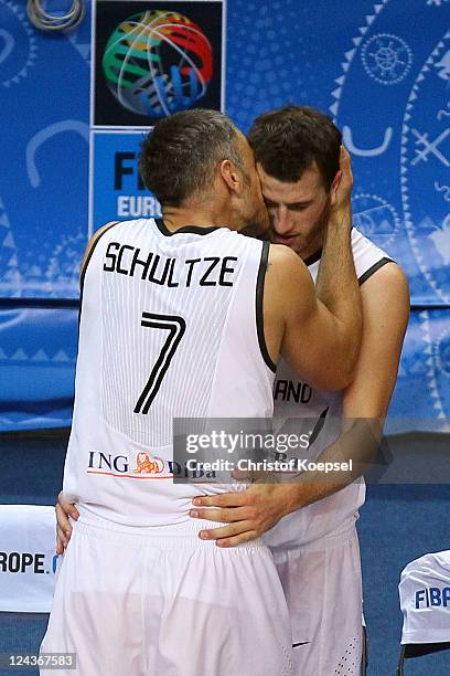 Sven Schultze and Philipp Schwethelm of Germany celebrate the 73-67 victory after the EuroBasket 2011 second round group E match between Germany and...