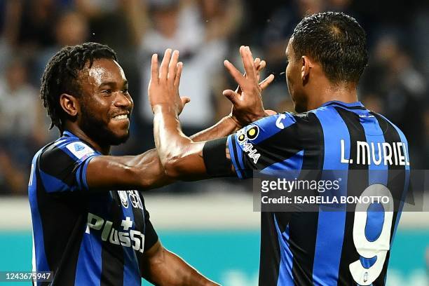 Atalanta's British midfielder Ademola Lookman celebrates with Atalanta's Colombian forward Luis Muriel after opening the scoring during the Italian...