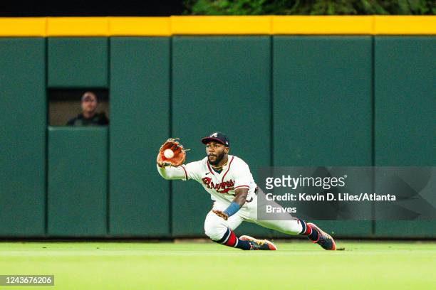 Michael Harris II of the Atlanta Braves makes a diving catch during the second inning against the New York Mets at Truist Park on October 01, 2022 in...