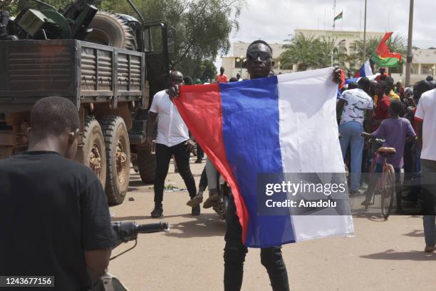 Supporters of Ibrahim Traore stage a demonstration in front of French embassy to protest against France, on October 2, 2022 in Ouagadougou, Burkina...