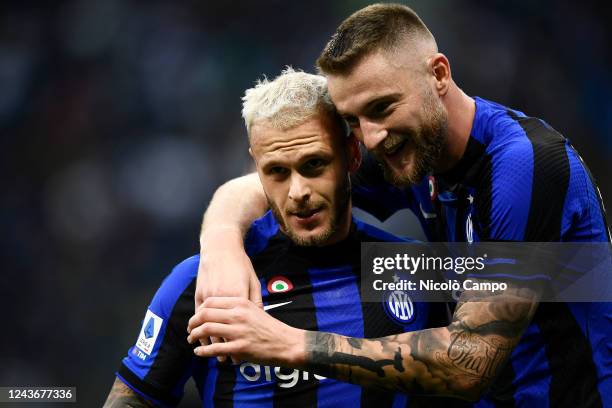 Federico Dimarco of FC Internazionale celebrates with Milan Skriniar of FC Internazionale after scoring the opening goal during the Serie A football...