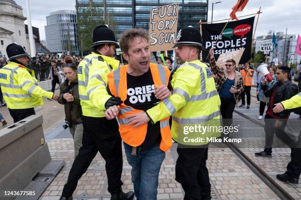 Police try to stop protesters marching through to the ICC at the People's Assembly Against Austerity protest to coincide with the opening of the...