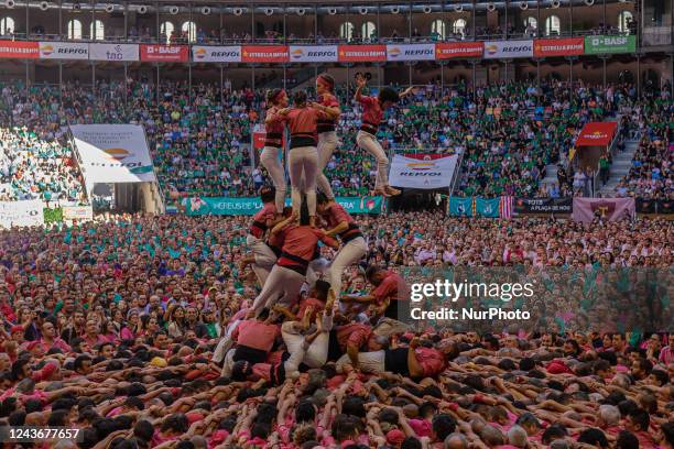 Different casteller groups raise their human castles to win the XXVIII castle contest, in Tarragona, Spain, on October 2, 2022. The Tarragona castle...