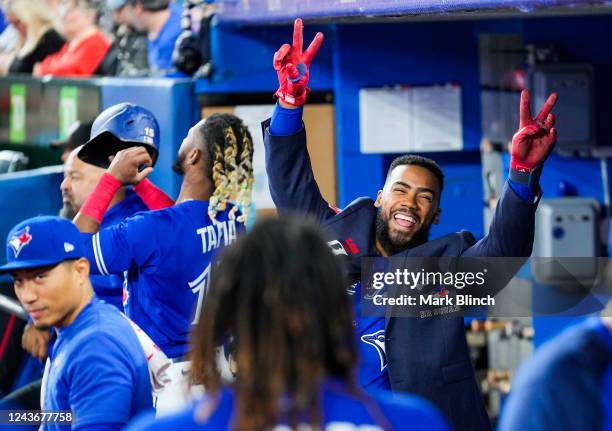 Teoscar Hernandez of the Toronto Blue Jays celebrates his home run against the Boston Red Sox in the dugout during the second inning of the MLB game...