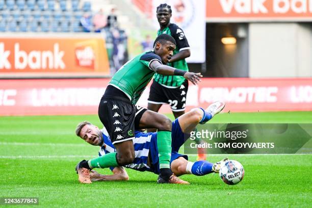 Cercle's Jean Harisson Marcelin and Gent's Laurent Depoitre fight for the ball during a belgian Pro League match between KAA Gent and Cercle Brugge...