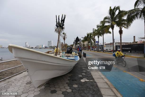 Picture of a boat removed from the sea and placed on the sidewalk ahead of the arrival of Hurricane Orlene, in Mazatlan, state of Sinaloa, Mexico, on...