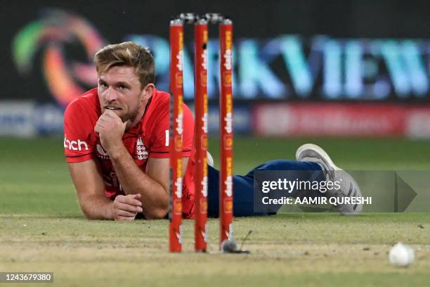 England's David Willey reacts after dropping the catch of Pakistan's Iftikhar Ahmed during the seventh Twenty20 international cricket match between...